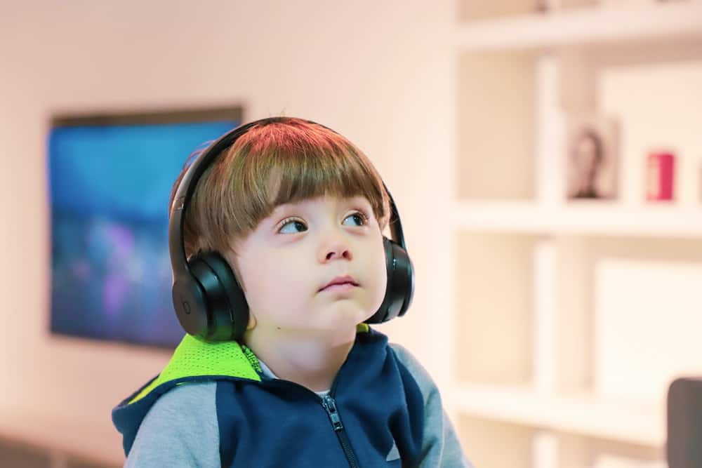 young vision impaired child receiving audio description