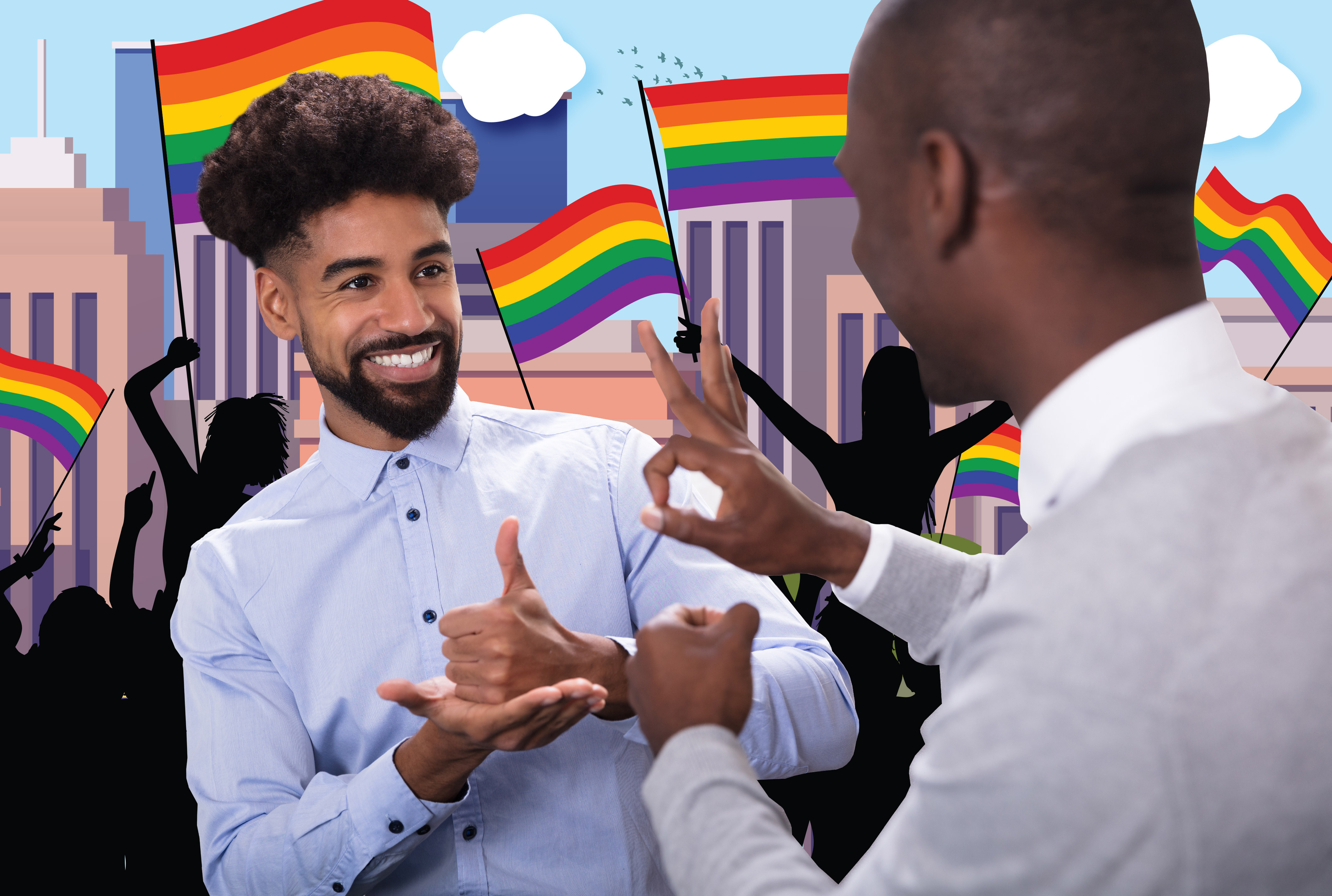 Two people signing to each other and smiling. One is signing 'support' and one is signing 'OK'. Behind them is a street scene with people waving rainbow flags for Pride.
